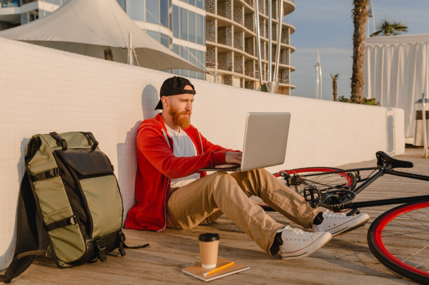 Man working remotely while checking insurance planning for digital nomads coverage