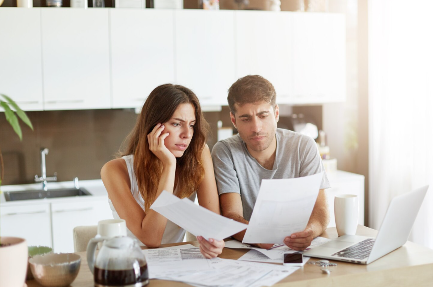 Couple reviewing insurance to revisit after getting married and updating shared policies