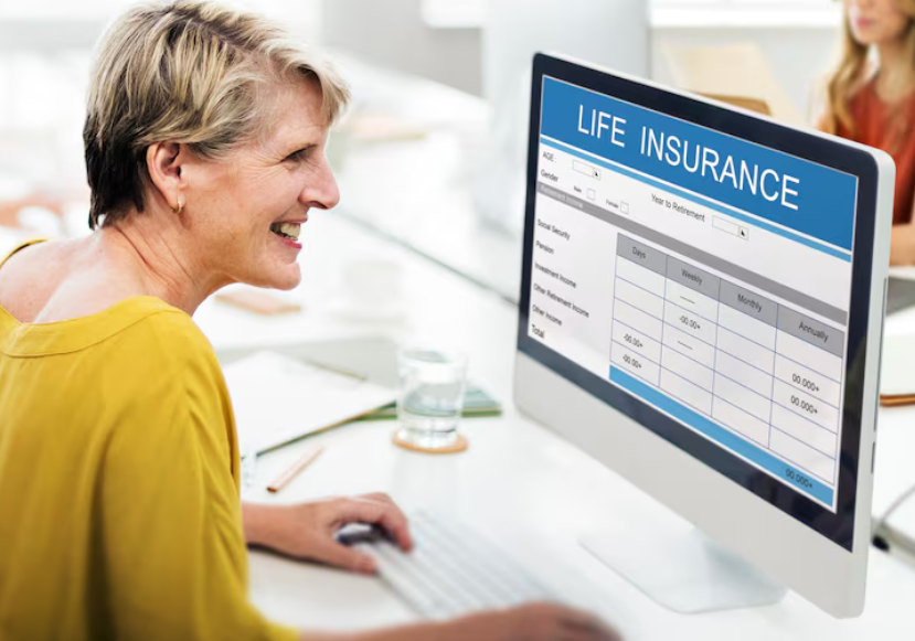 Woman reviewing life insurance quotes online to decide when to switch insurance providers